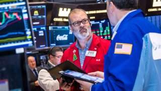 Traders work at the New York Stock Exchange on Dec. 17, 2024.