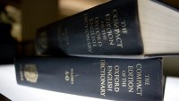 FILE- In this Aug. 29, 2010 file photo, an Oxford English Dictionary is shown at the headquarters of the Associated Press in New York.