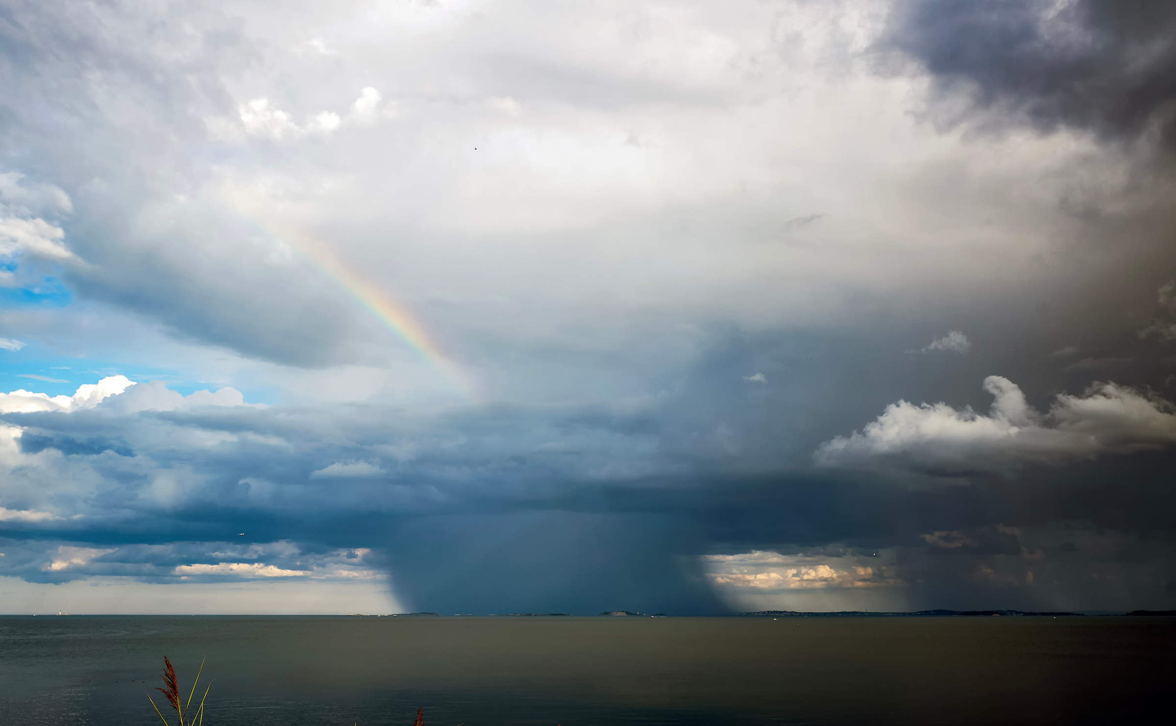 April 12, 2024: A dying thunderstorm is seen over Quincy as a rainbow forms.