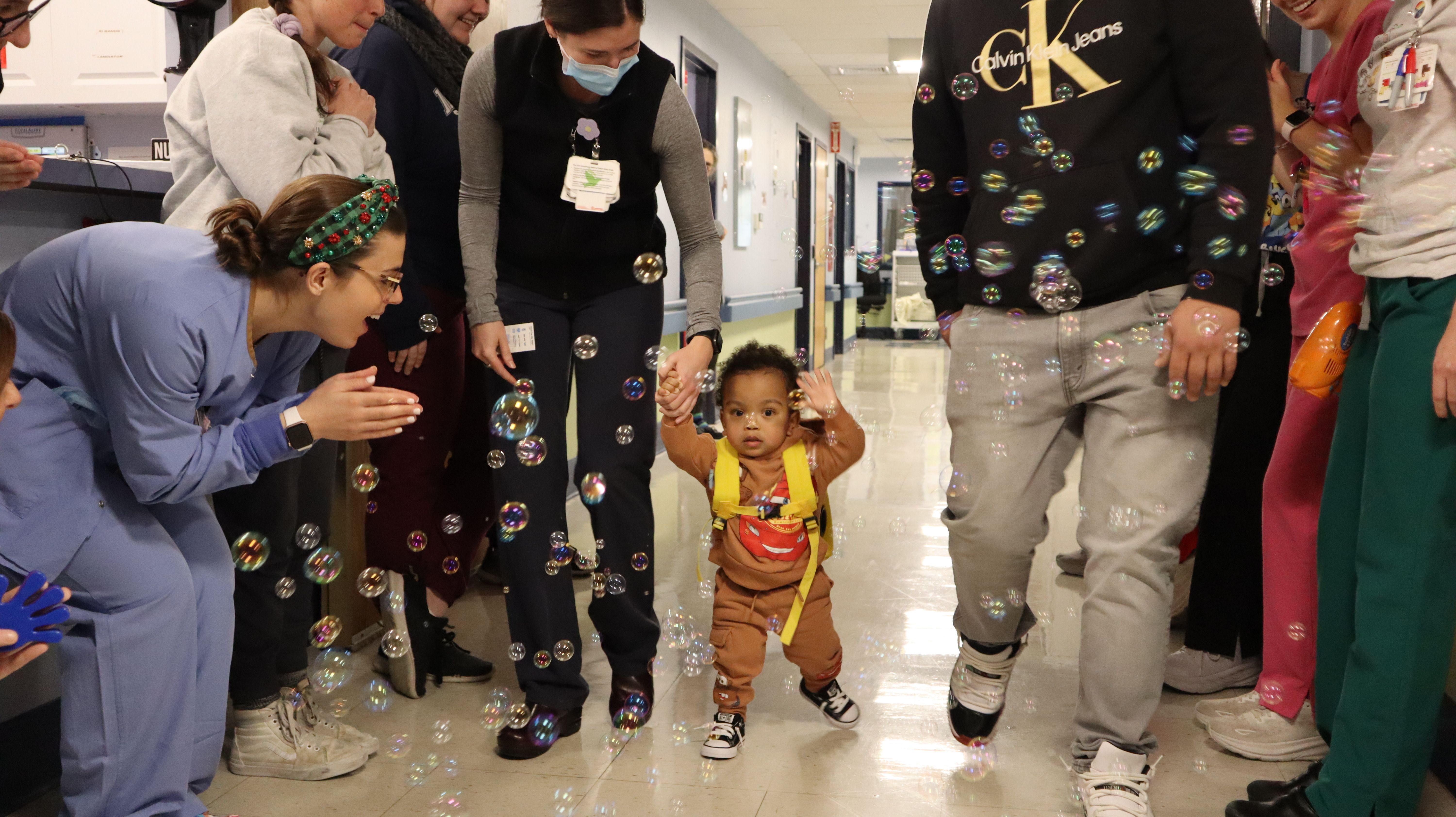 Jesus Radon Santos gets a bubble parade as the toddler finally leaves Franciscan Children's Hospital in Boston on Wednesday, Dec. 18, 2024.