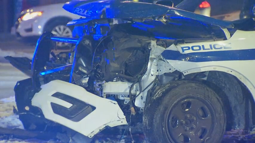 A crashed Boston police cruiser being towed from Green Line tracks Monday, Dec. 23, 2024.