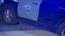 A Massachusetts State Police cruiser with damage in Boston on Friday, Dec. 6, 2024.