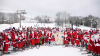 Over 300 skiing Santas raise $9,000 for charity in Maine