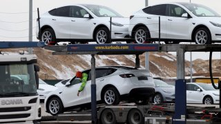 A worker reverses a Tesla Model Y electric vehicle onto a freight trailer at the Tesla Inc. Gigafactory in Gruenheide, Germany, on Saturday, Jan. 21, 2023. Tesla CEO Elon Musk played down how much impact his tweets have on the company’s stock price as he defended himself at a trial in San Francisco federal court on Friday over his 2018 tweet about taking the electric car-maker private. Photographer: Liesa Johannssen/Bloomberg via Getty Images