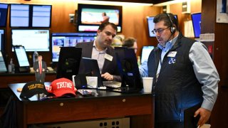 Traders work on the floor of the New York Stock Exchange during the opening bell on Nov. 13, 2024.