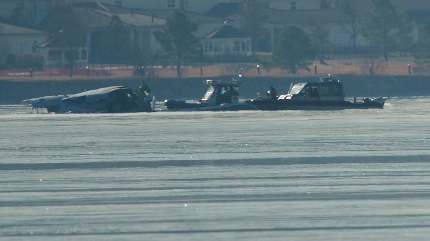 Emergency response units search the crash site of the American Airlines plane on the Potomac River after the plane crashed on approach to Reagan National Airport on January 30, 2025 in Arlington, Virginia. 