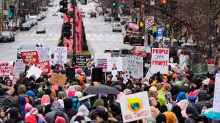 A group gathers in Farragut Square before the start of the People’s March, Sat. Jan. 18, 2025, in D.C.