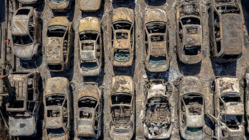 Burned vehicles at the Altadena Auto Center after the Eaton Fire.