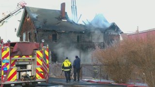 Firefighters on the scene of a deadly fire on Cotter Street in New Bedford, Massachusetts, on Jan. 20, 2025.