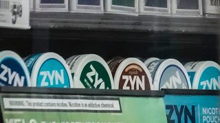 FILE - Containers of Zyn, a smokeless nicotine pouch, are displayed for sale among other nicotine and tobacco products at a newsstand on Feb. 23, 2024, in New York.