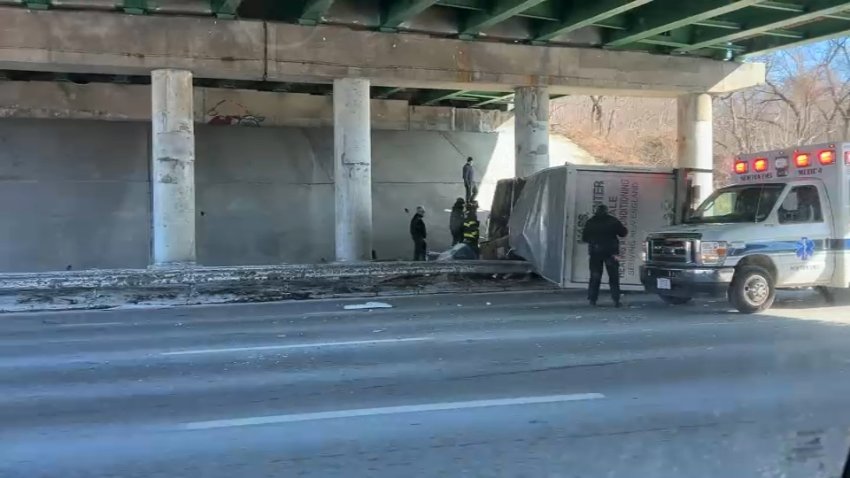 A truck crashed under an overpass on I-95 in Newton, Massachusetts, on Monday, Jan. 27, 2025.