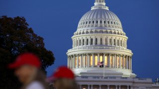 Trump supporters walk near the U.S. Capitol building as the sun sets the day U.S. President Elect Donald Trump was declared the winner of the presidential election in Washington, U.S., November 6, 2024. 