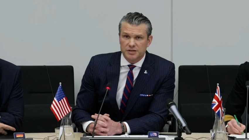 Pete Hegseth speaking at a desk at NATO