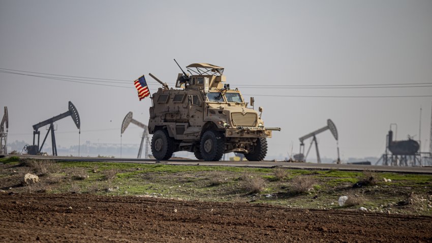 FILE - U.S. military vehicle is seen on a patrol in the countryside near the town of Qamishli, Syria, Sunday, Dec. 4, 2022. Forty years after one of the deadliest attacks against U.S. troops in the Middle East, some warn that Washington could be sliding toward a new conflict in the region.