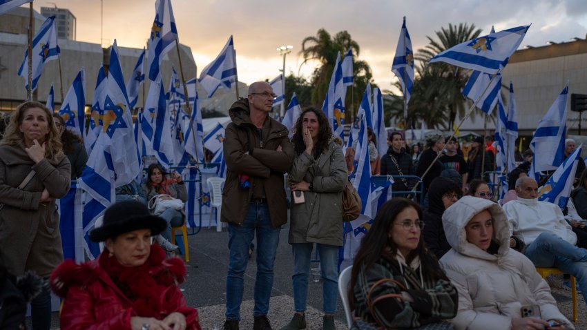 People gather at a vigil in Tel Aviv, Israel, hours after Hamas militants turned over four bodies to Israel.