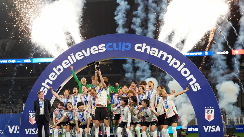 Players for Japan celebrate after defeating the United States to win the SheBelieves Cup women's soccer tournament.