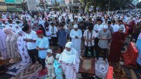 Indonesian Muslims attend Eid al-Fitr prayer at Ampera Bridge in Palembang, South Sumatera, Indonesia on May 02, 2022. Muslims around the world are celebrating Eid al-Fitr marks the end of the Muslim fasting month of Ramadan.