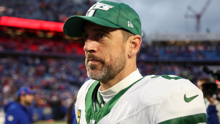 ORCHARD PARK, NEW YORK – DECEMBER 29: Aaron Rodgers #8 of the New York Jets walks off the field after a game against the Buffalo Bills at Highmark Stadium on December 29, 2024 in Orchard Park, New York. The Bills defeated the Jets 40-14.