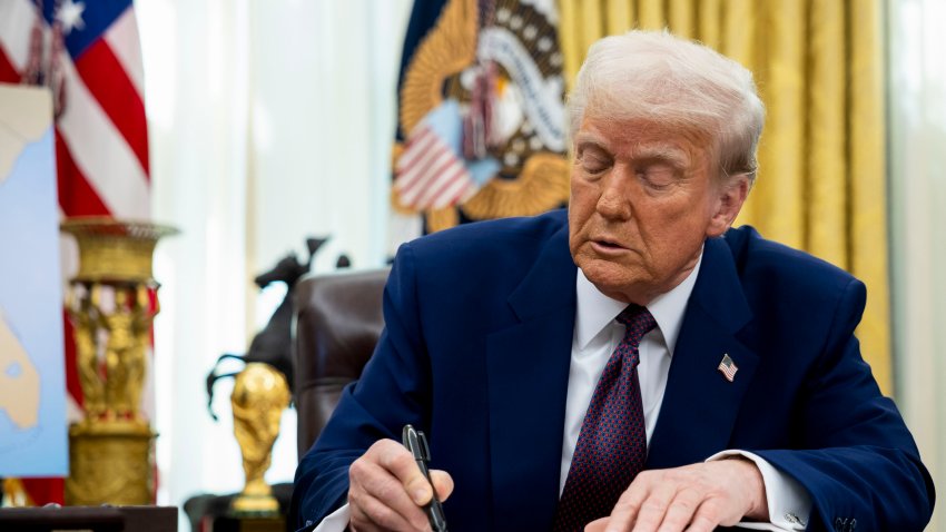 US President Donald Trump signs an executive order in the Oval Office of the White House in Washington, DC, US, on Thursday, Feb. 13, 2025. The president on Thursday signed a measure directing the US Trade Representative and Commerce secretary to propose new levies on a country-by-country basis in an effort to rebalance trade relations, a sweeping process that could take weeks or months to complete, according to a senior White House official, leaving no clear date when they would take effect. Photographer: Francis Chung/Politico/Bloomberg via Getty Images