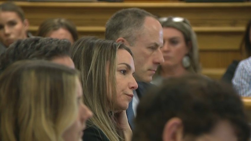 Karen Read, seated between her lawyers in Norfolk Superior Court, for a pretrial hearing on Tuesday, Feb. 25, 2025.