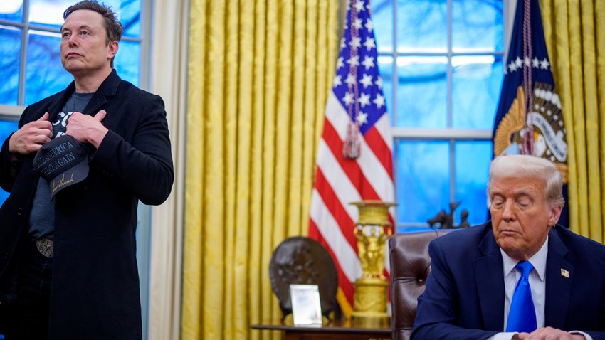 Elon Musk and Donald Trump appear during an executive order signing in the Oval Office at the White House on Feb. 11, 2025 in Washington, D.C.