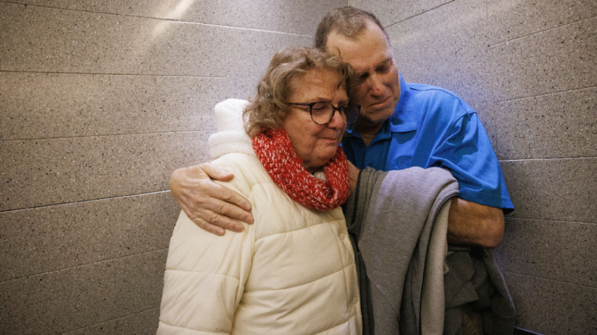 Tim Andrews and his wife, Karen, share an embrace while leaving Massachusetts General Hospital on Feb. 1, 2025.
Source: Kate Flock/Massachusetts General Hospital via AP