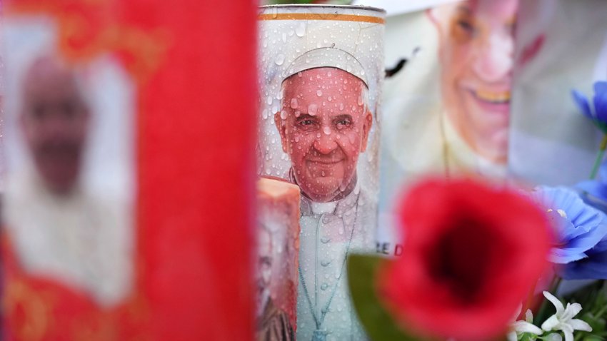 Candles and flowers for Pope Francis are seen at the Agostino Gemelli Polyclinic, in Rome, Tuesday, Feb. 25, 2025 where Pope Francis has been hospitalized since Friday, Feb. 14.