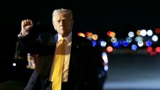 U.S. President Donald Trump pumps his fist after deboarding from Air Force One upon arrival in West Palm Beach, Florida, U.S., March 7, 2025. 