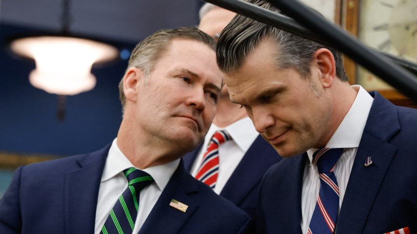 (L-R) US National Security Advisor Mike Waltz speaks with Defense Secretary Pete Hegseth as US President Donald Trump meets with French President Emmanuel Macron in the Oval Office of the White House in Washington, DC, on February 24, 2025. 