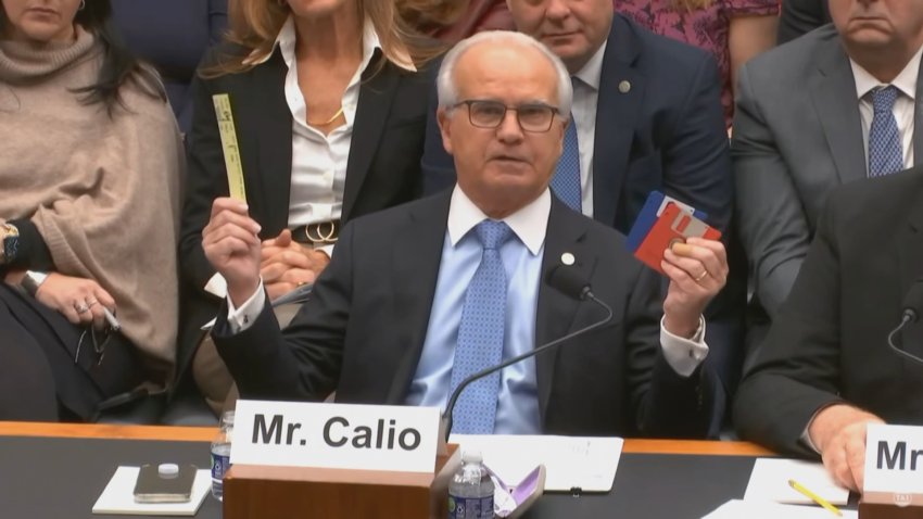 CEO holds up floppy disk and paper strips