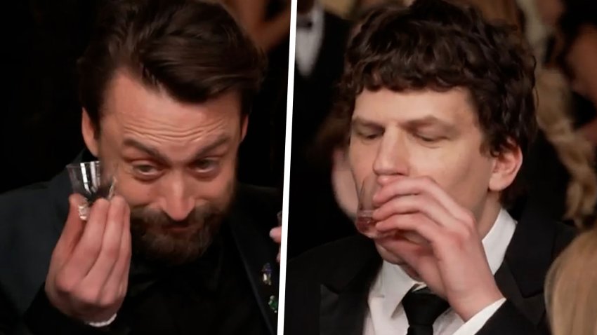Kieran Culkin and Jesse Eisenberg do shots with Mario Lopez at 2025 Oscars