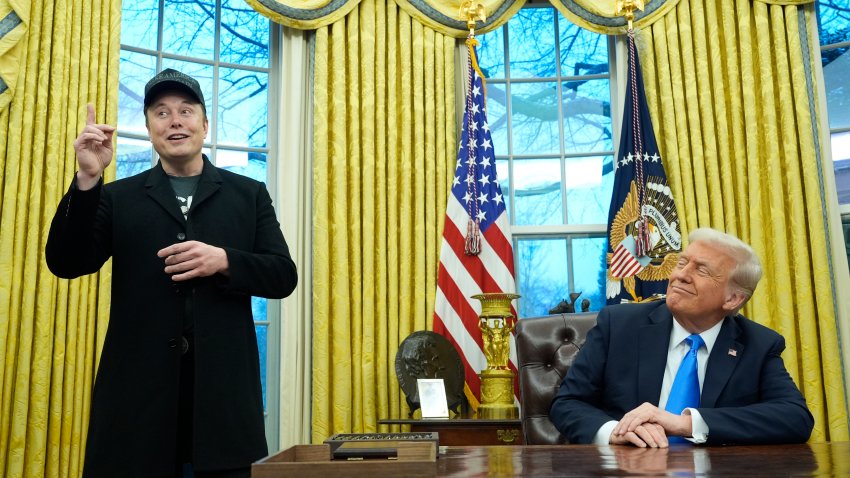 President Donald Trump listens as Elon Musk speaks in the Oval Office at the White House, Tuesday, Feb. 11, 2025, in Washington.