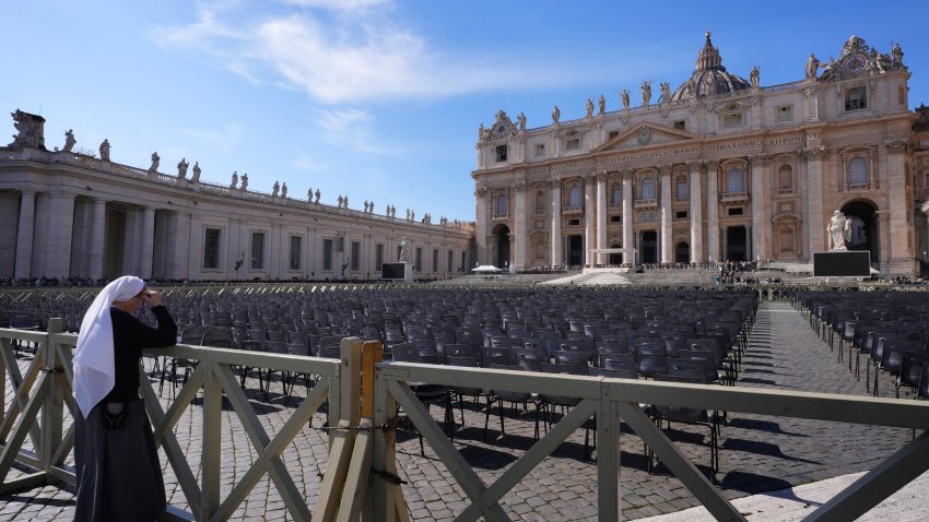 A nun prays at the Vatican at the time when Pope Francis would usually bestow his blessing