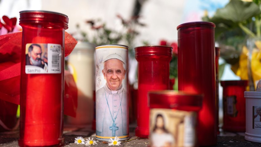 Candles left outside the Agostino Gemelli Polyclinic, in Rome, Monday, March 3, 2025 where Pope Francis is hospitalized since Friday, Feb. 14.