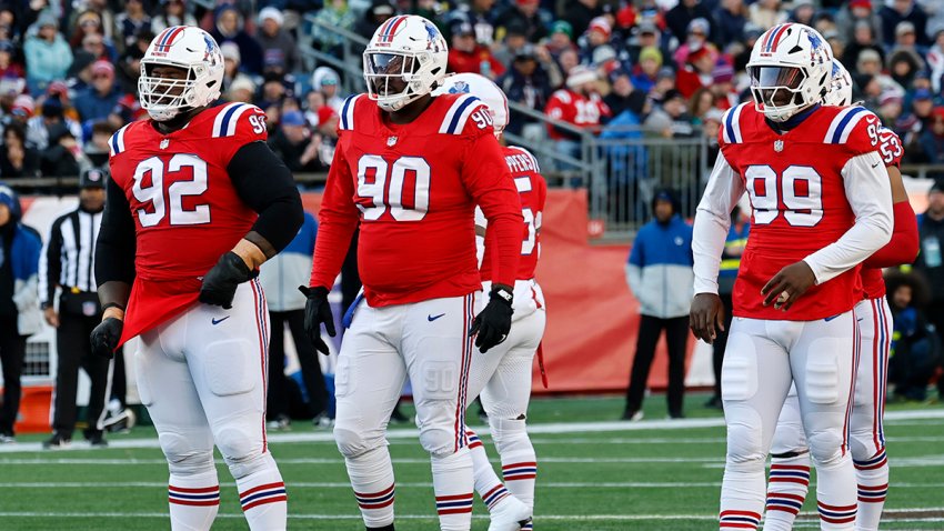 Patriots nose tackle Davon Godchaux, defensive end Christian Barmore and defensive end Keion White