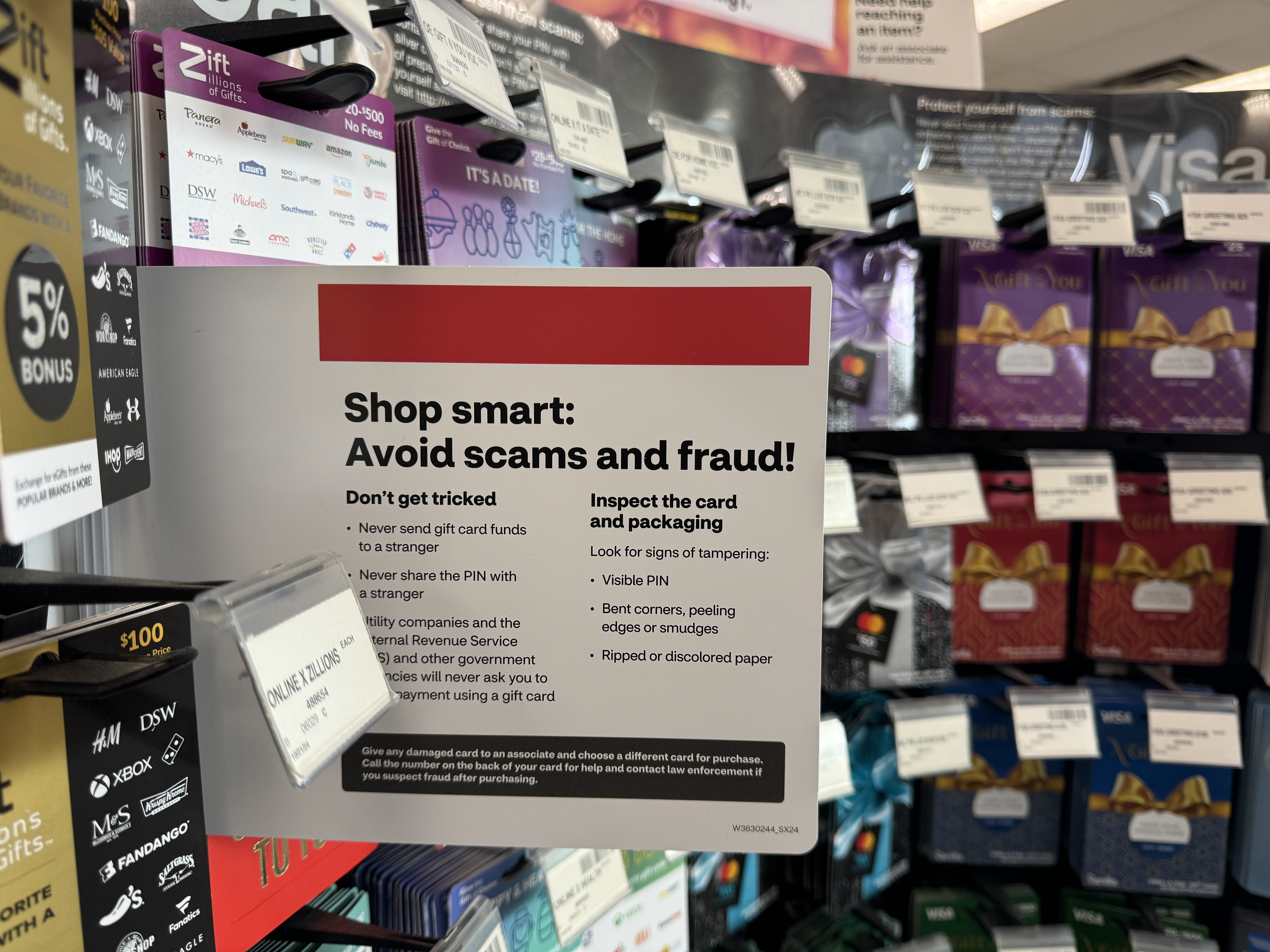 A gift card scam warning at a store.