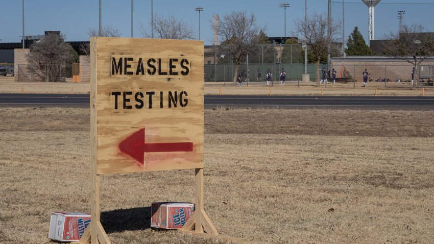 FILE - Signs point the way to measles testing in on Feb. 27, 2025, in Seminole, Texas.