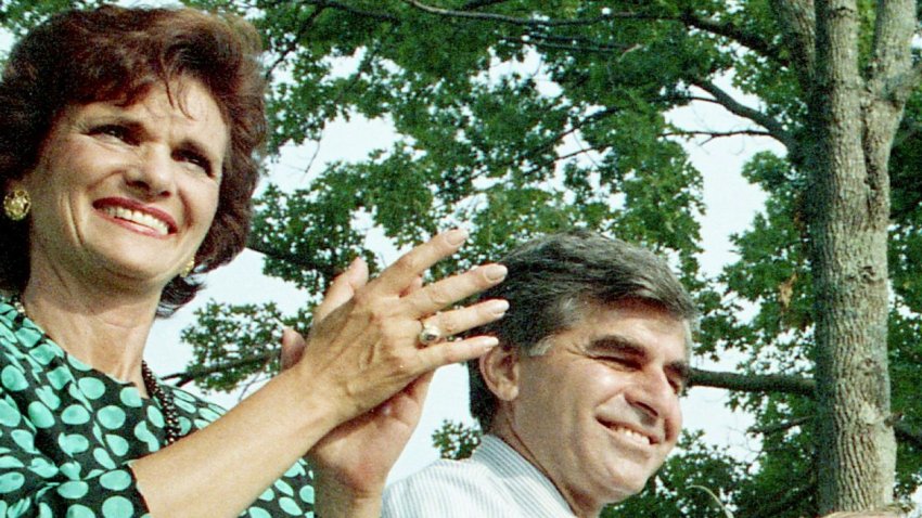 Kitty Dukakis, seated next to her husband, Democratic presidential candidate Michael Dukakis, claps during a speech being given by Sen. Albert Gore Jr., at the Wilson County Fair Aug. 20, 1988.