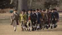 Reenactors in minuteman uniform practicing on the Lexington Battle Green on Thursday, March 13, 2025, for the 250th anniversary of the battles of Lexington and Concord.