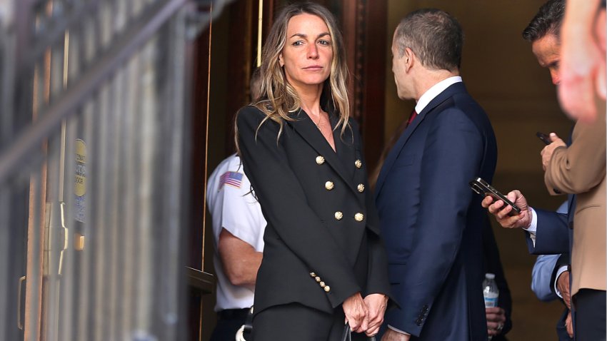 Dedham, MA – June 27: Karen Read stands in the doorway as she waits to leave Norfolk Superior Court. (Photo by John Tlumacki/The Boston Globe via Getty Images)