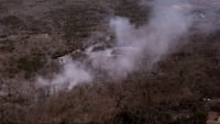Smoke from a brush fire burning in Middleton, Massachusetts, on Wednesday, March 12, 2025.