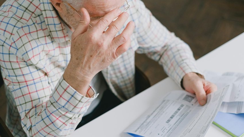 Senior looking at document