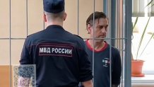 FILE - In this photo taken from video released by Khamovnichesky District Court press service on July 18, 2024, U.S. citizen Michael Travis Leake stands in a cage in a courtroom in the Khamovnichesky District Court, in Moscow, before being convicted of drug trafficking charges and sentenced to 13 years in prison. (Khamovnichesky District Court via AP, File)