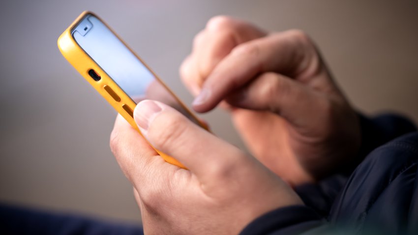 Close up of hands with a phone