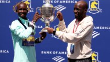BOSTON, MASSACHUSETTS - APRIL 21: (L-R) John Korir of Kenya and his brother Wesley pose with the trophy after winning the 129th Boston Marathon Men's division on April 21, 2025 in Boston, Massachusetts. (Photo by Maddie Meyer/Getty Images)
