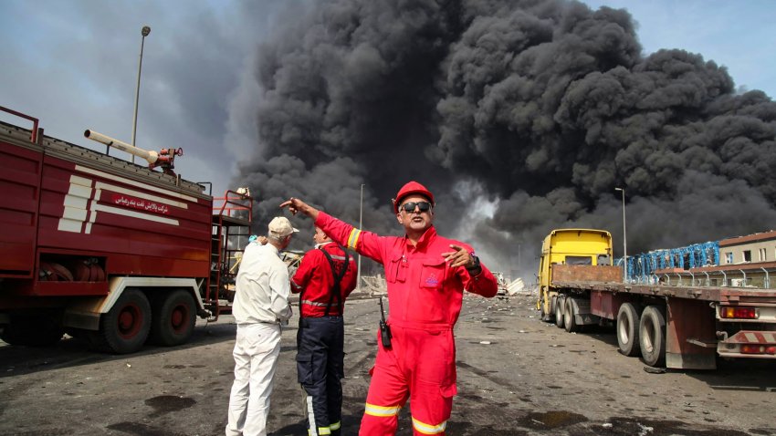 Thick, black smoke rises as rescuers arrive near the source of an explosion at the Shahid Rajaee port dock southwest of Bandar Abbas in the Iranian province of Hormozgan on April 26, 2025.