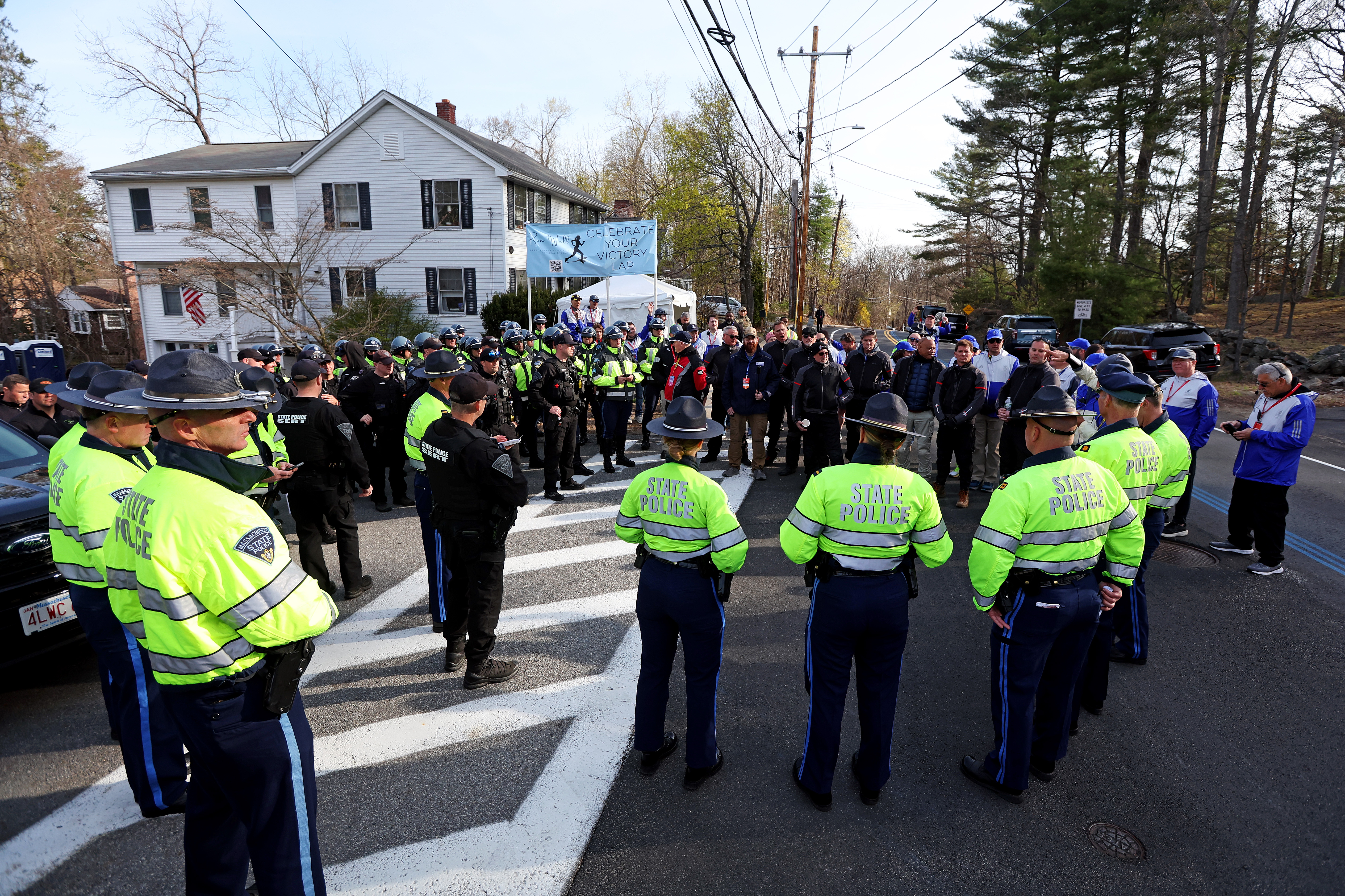 Apr 21, 2025; Hopkinton, MA, USA; Police and officials meet before the start of the 2025 Boston Marathon. Mandatory Credit: Paul Rutherford-Imagn Images