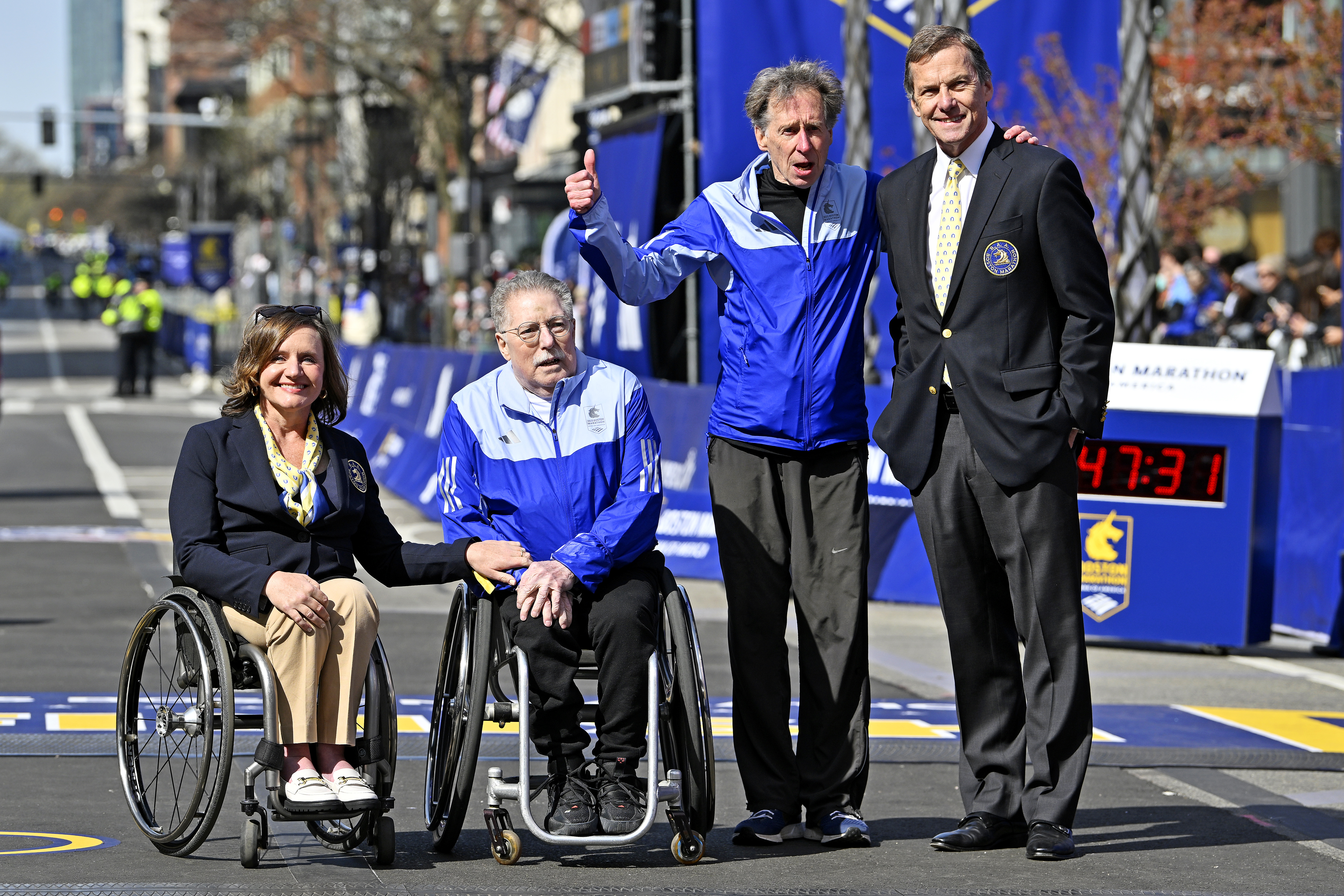 Apr 21, 2025; Boston, MA, USA; Cheri Blauwet, Chair of the Board of Governors for the BAA; Bob Hall, first official wheel chair champion in 1975; Bill Rodgers, 1975 champion pose for a photo before the 2025 Boston Marathon. Mandatory Credit: Eric Canha-Imagn Images