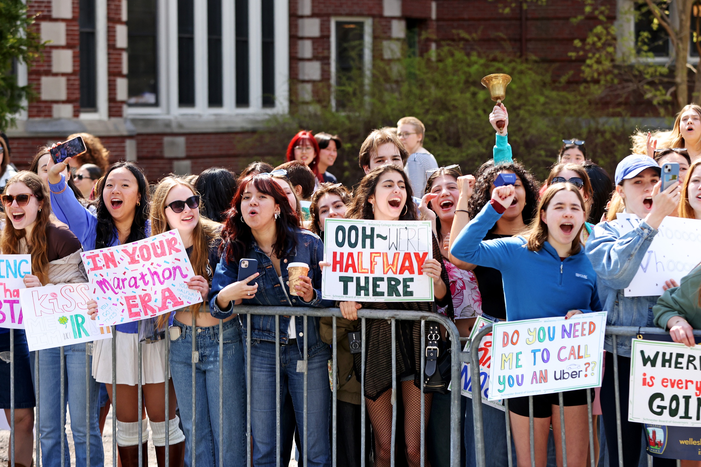 Spectators cheer from the side of the road during the 2025 Boston Marathon.