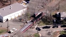 An MBTA train stopped at a railroad crossing in Canton, Massachusetts, after colliding with a tractor-trailer on Wednesday, April 9, 2025.